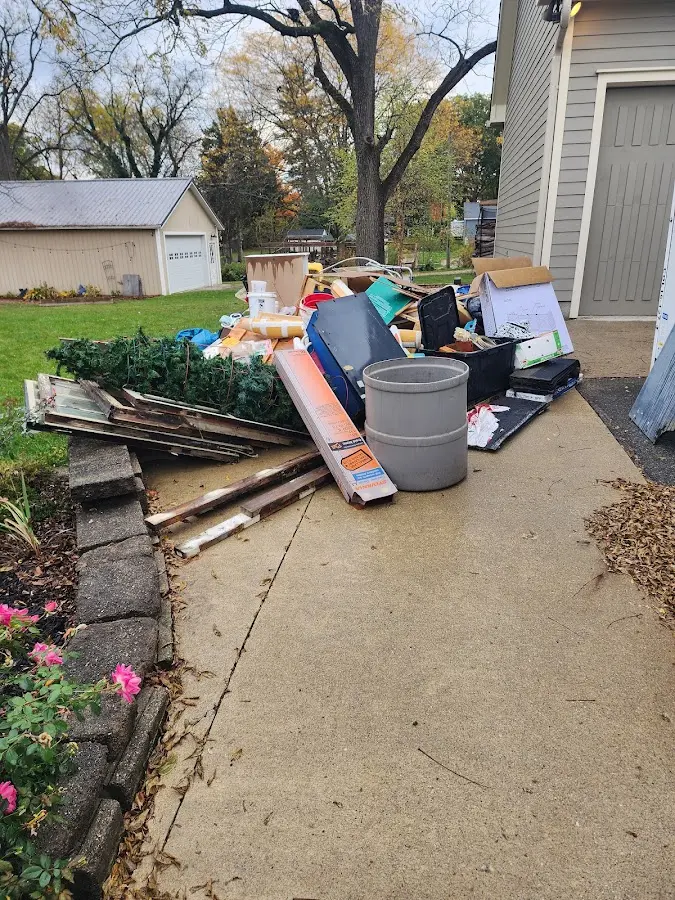 Dumpster being loaded with debris for Demolition Dumpster Rental in Hellertown